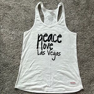White sleeveless tank top with scoop neck and printed design